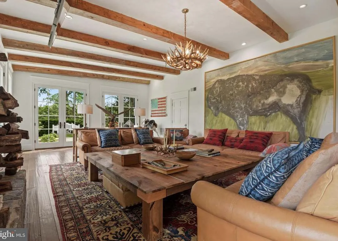 Rustic living room with large bison painting.