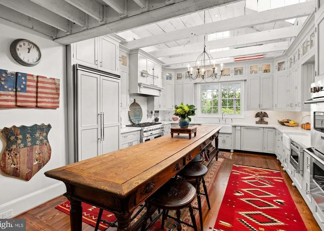 Rustic kitchen with wooden table and decor.