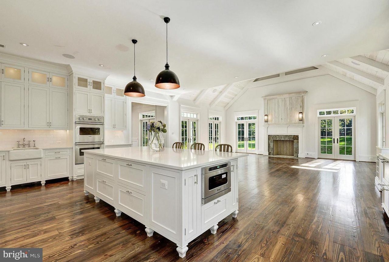 Spacious kitchen with island and hardwood floors.